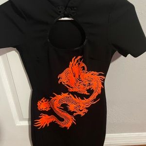 Bought from fashion nova, size small. Black dress with orange detailing